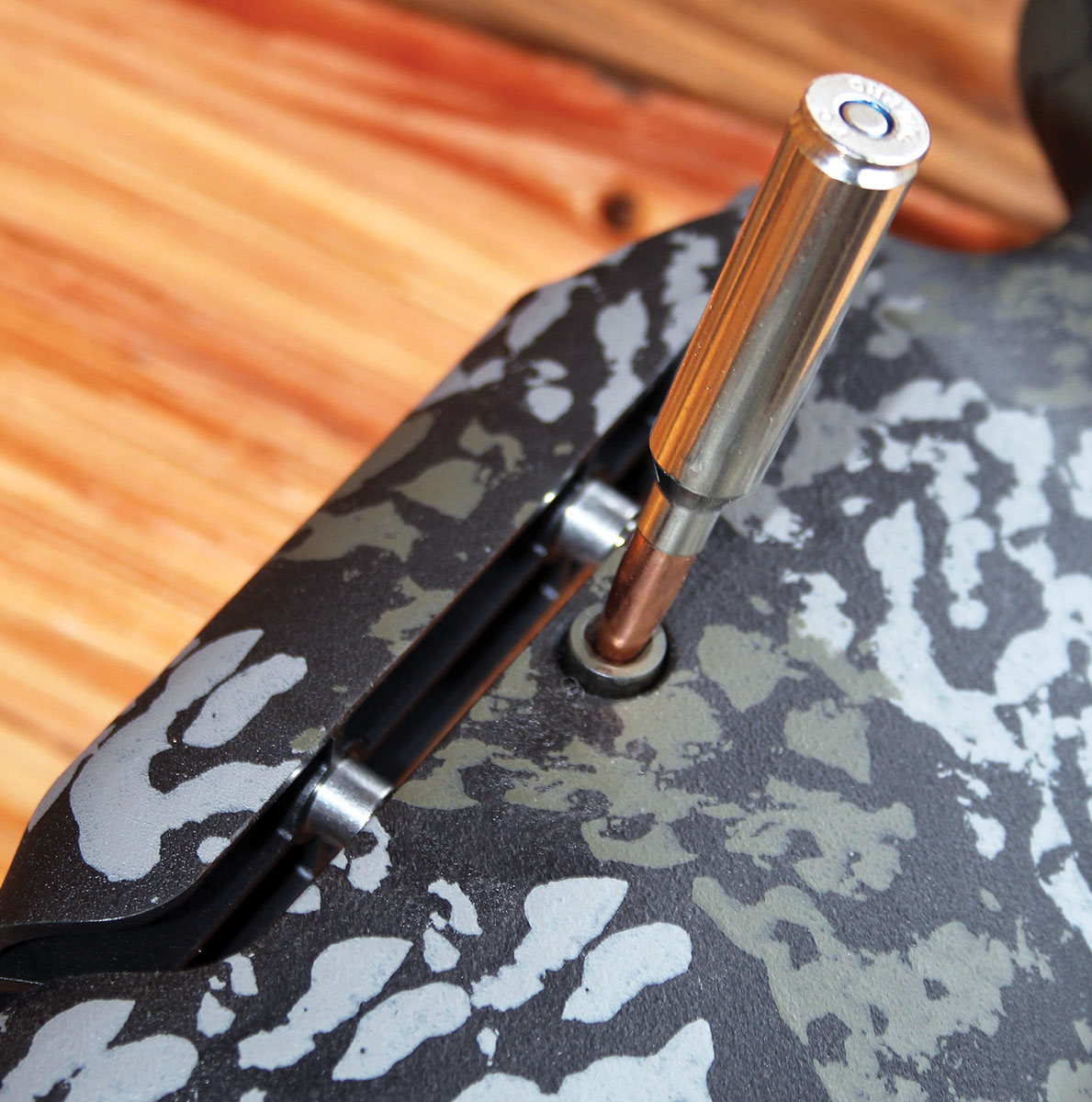 Adjusting the comb requires pushing the release button below the stock surface. This is easily accomplished using a loaded cartridge.